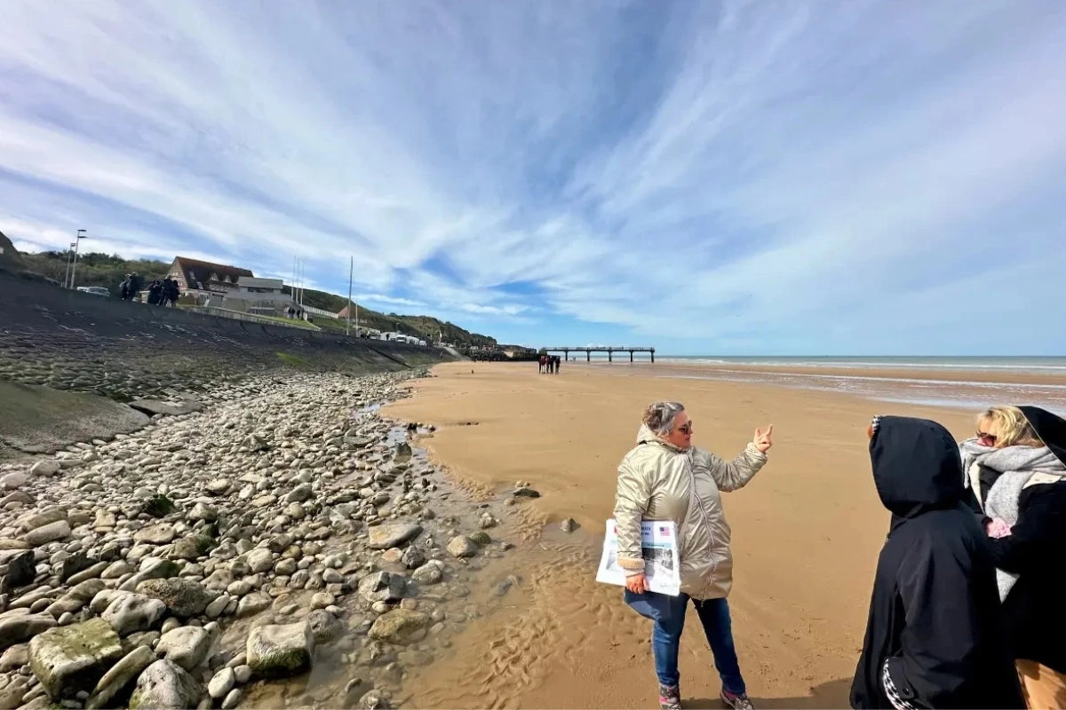 A Link Paris guide on Omaha Beach in Normandy.