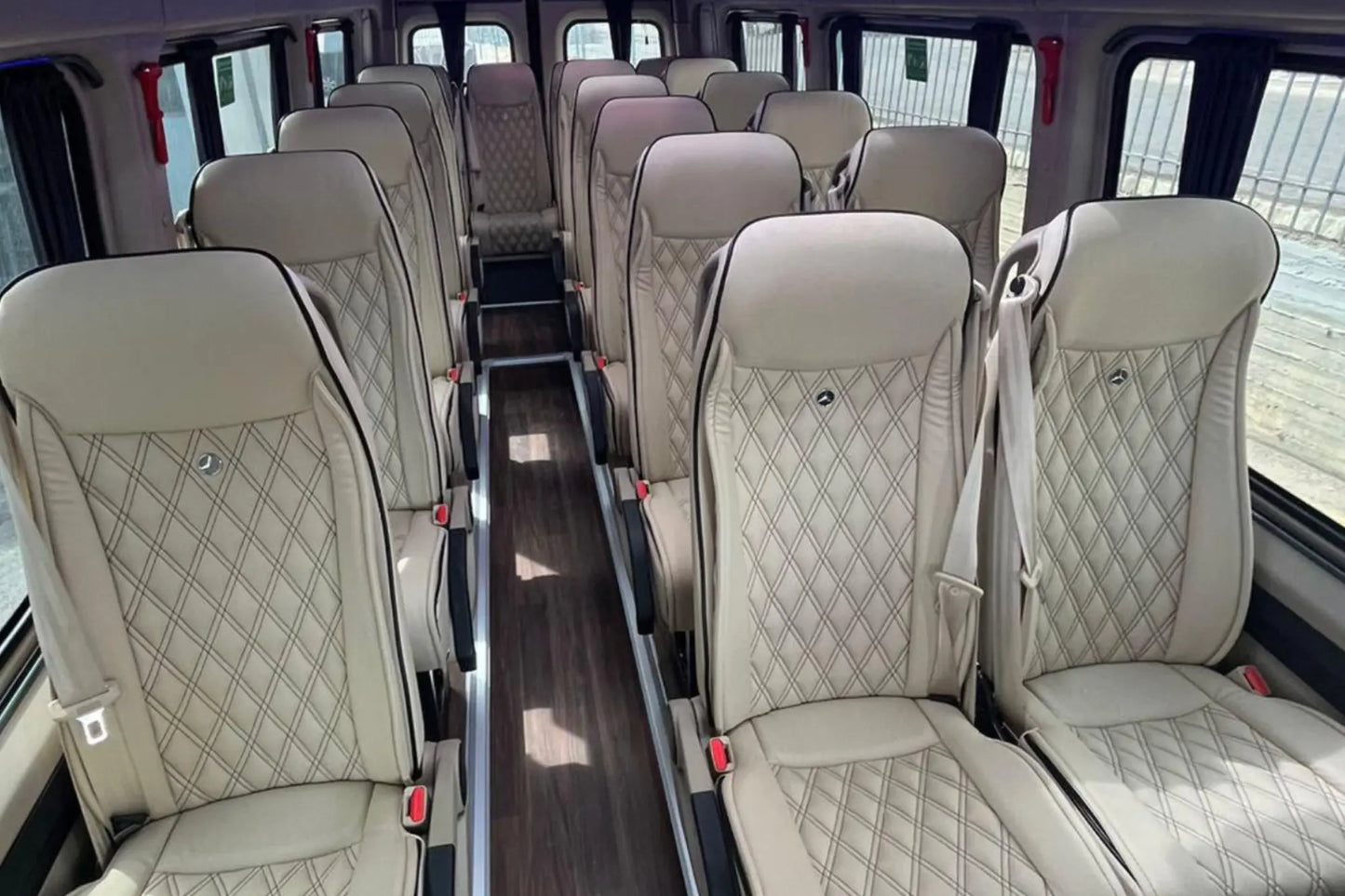 The interior of a 22 seat Mercedes Sprinter van. Available for transfers to or from Paris.