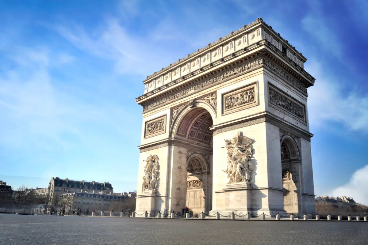 The Arc de Triomphe on a beautiful day in Paris.