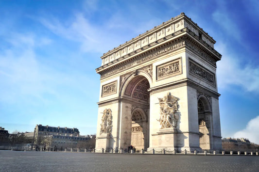 The Arc de Triomphe on a beautiful day in Paris.