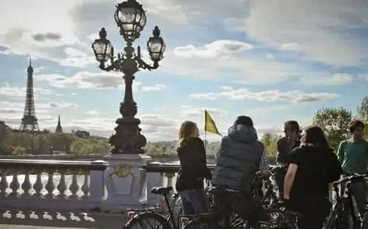 Paris small group bike tours: a stop on a bridge in Paris.