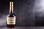 Load image into Gallery viewer, A bottle of Hennessy cognac.
